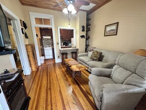 Bear Point Suite, 1 Queen Bed with Sofa bed, Patio | Living area | 32-inch flat-screen TV with satellite channels, TV, fireplace - Calhoun House Inn & Suites (Bryson City)
