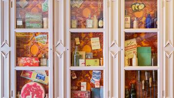 A display of vintage items including bottles, boxes, and tools.