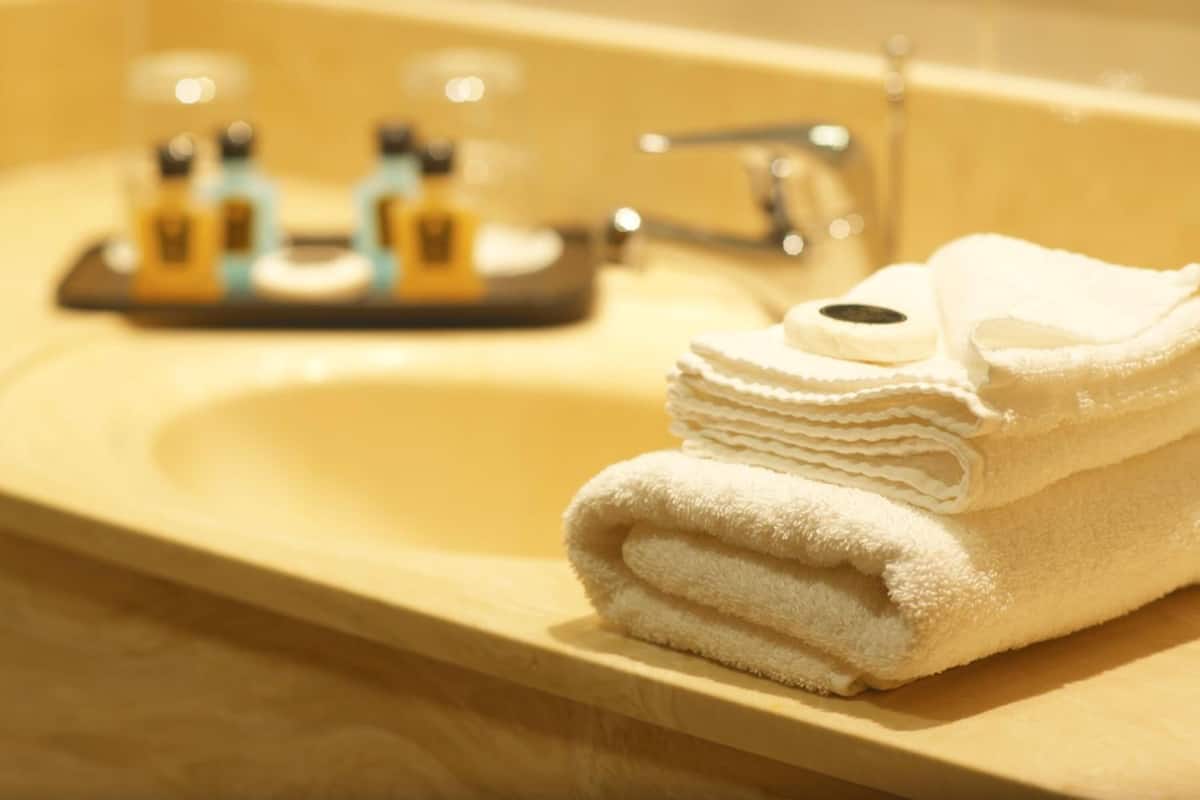 bathtub, free toiletries, hair dryer, slippers