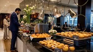 A buffet with various pastries and a coffee station. - Millennium Central Dubai Downtown (Dubai)