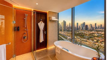 Combined shower/bathtub, designer toiletries, hair dryer, slippers