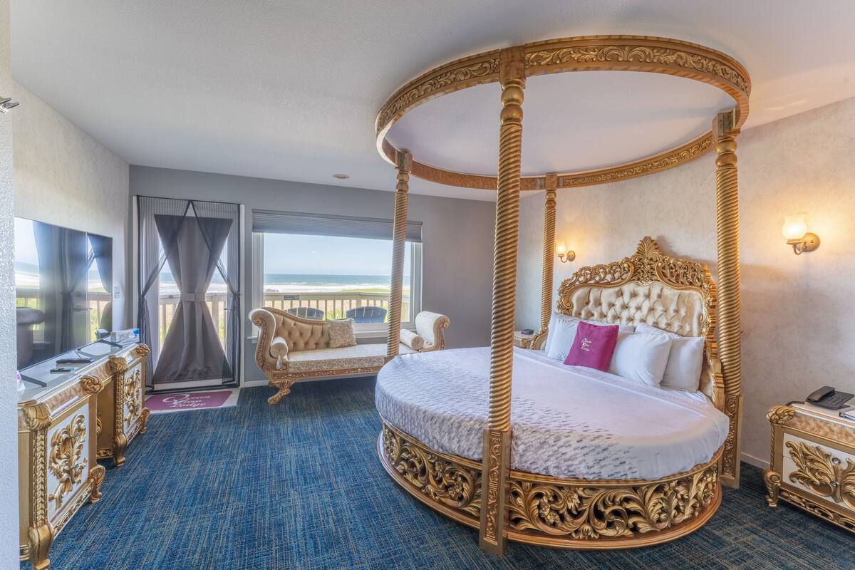 A luxurious room with a four-poster bed, a balcony with a view, and a classic design.