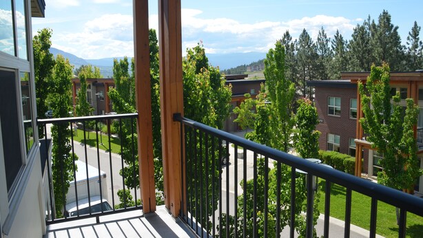 A balcony with a view of neighboring buildings and trees. - University of British Columbia - UBC Okanagan Campus (Kelowna)