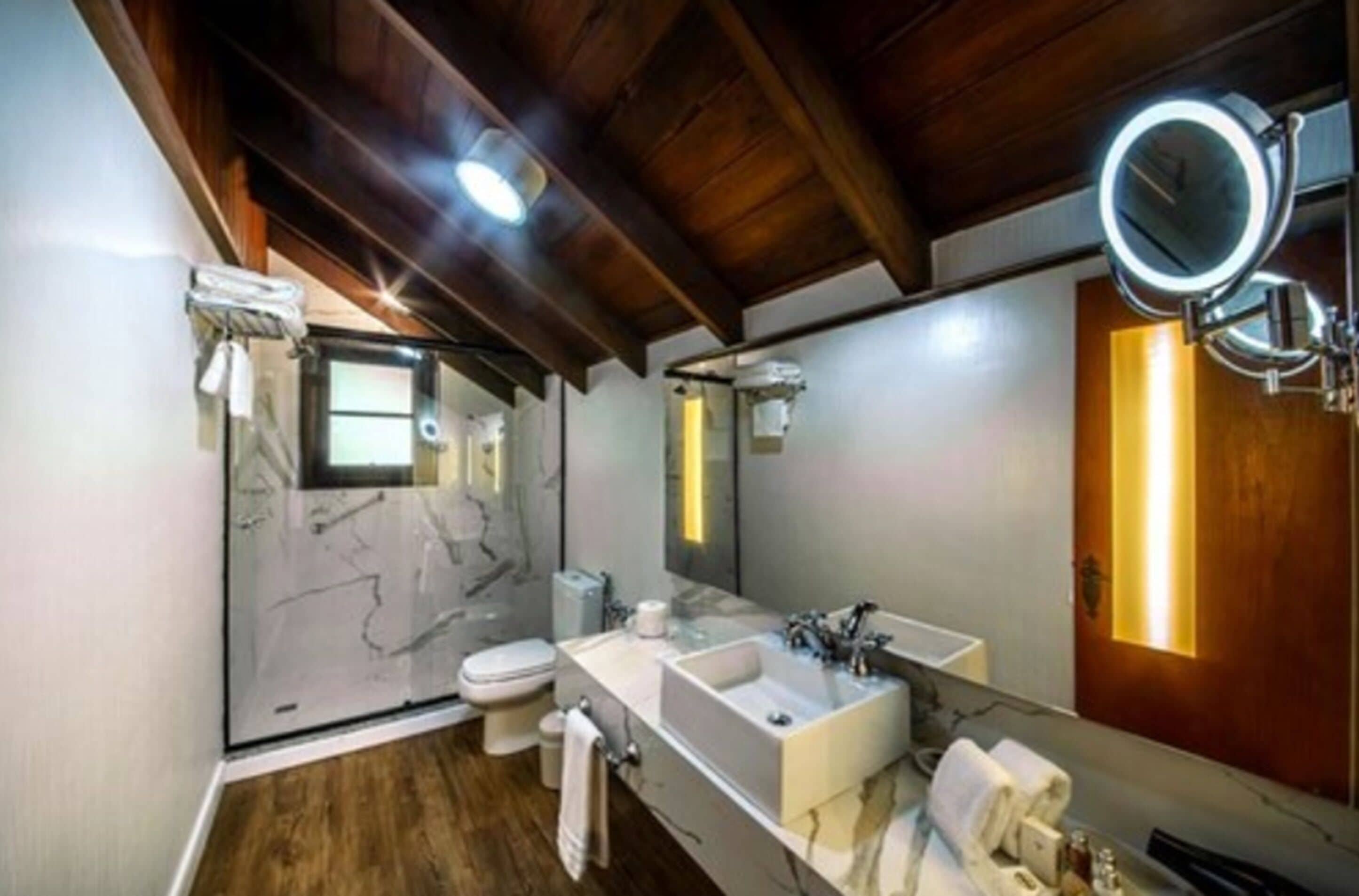 junior suite | bathroom | shower, free toiletries, hair dryer, bathrobes