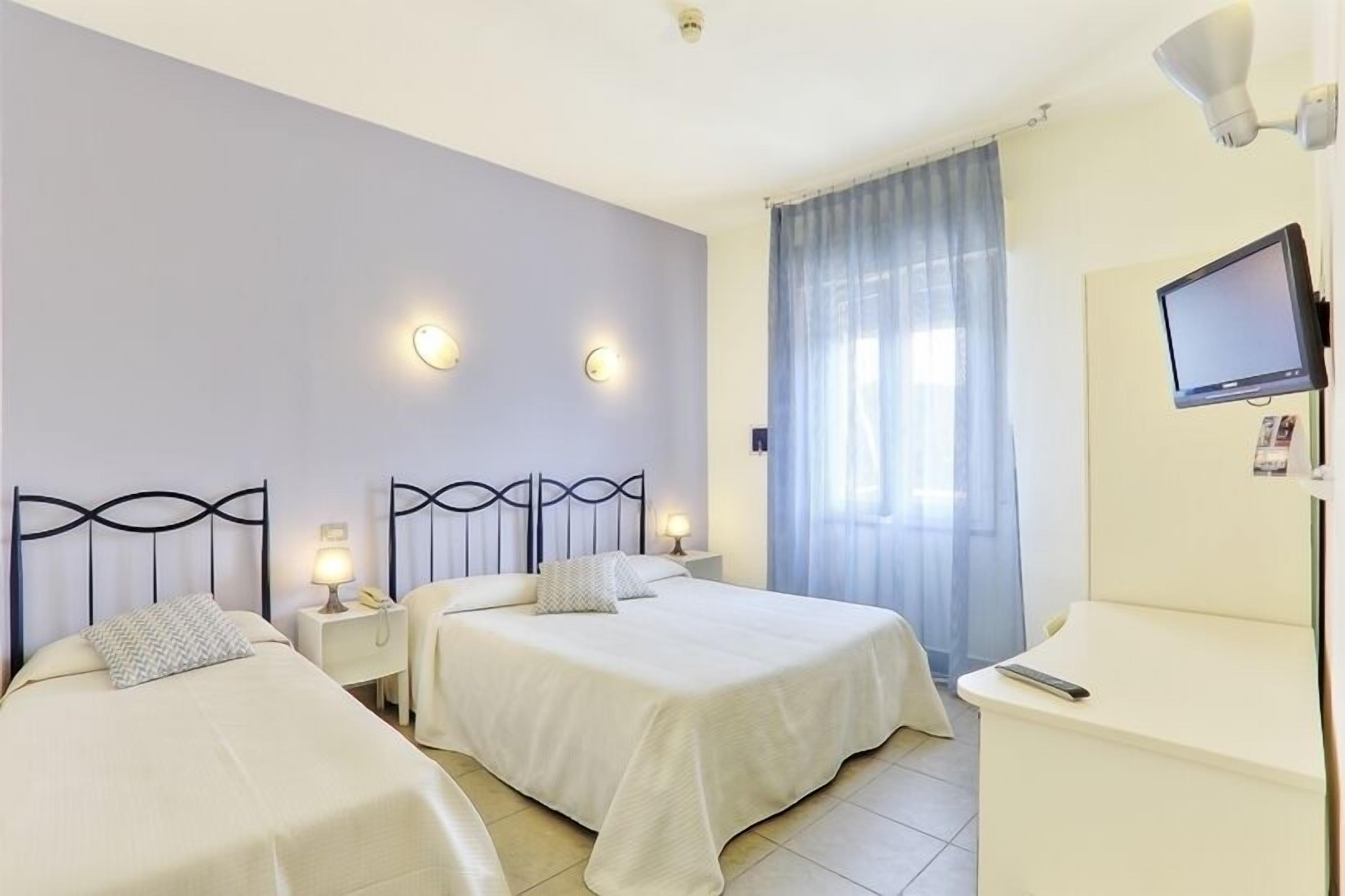 triple room | frette italian sheets, select comfort beds, minibar, in-room safe