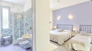 A bathroom with a shower, toilet, and sink. The room has a tiled floor and a window. The image also shows a bedroom with two beds, nightstands, and a chair. - Hotel Nina (Bibbona)
