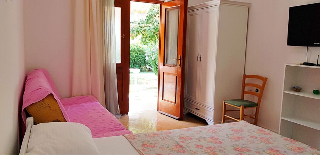 economy studio, garden view, ground floor | living area | lcd tv