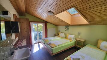 Triple Room, Balcony | Select Comfort beds, in-room safe, individually decorated, desk