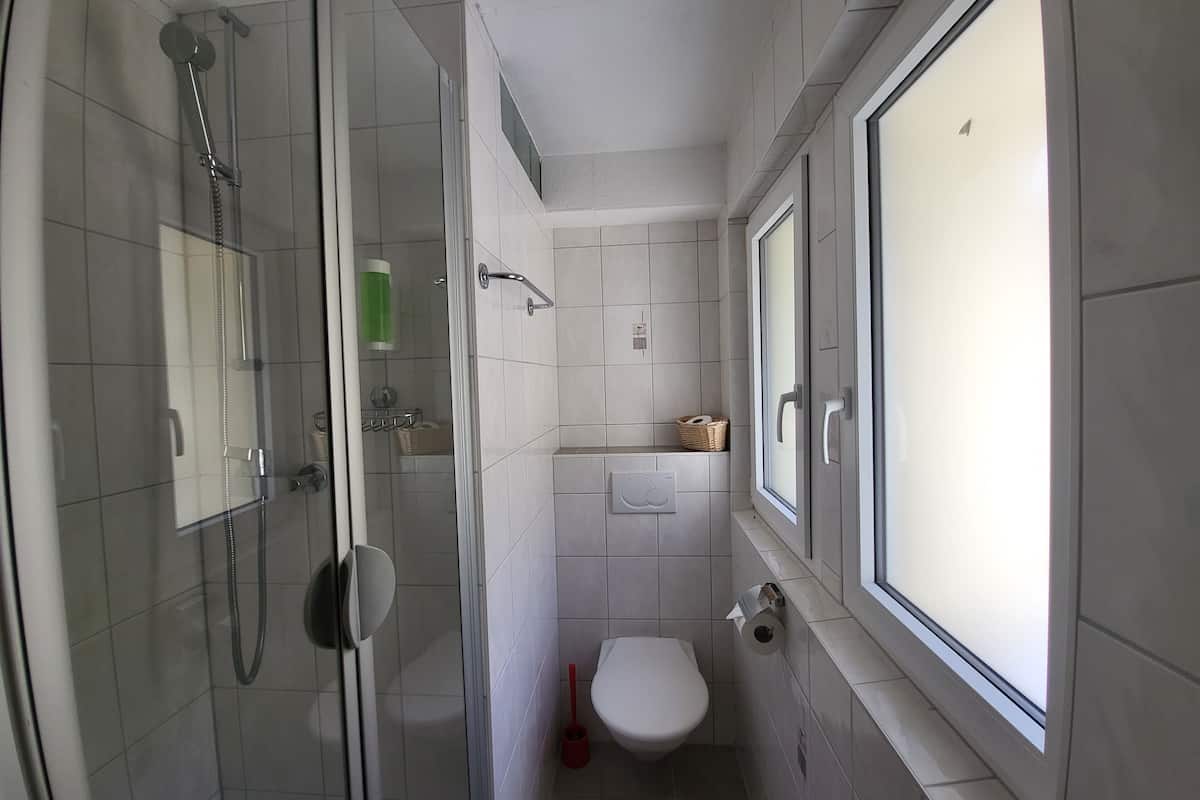 superior single room, balcony | bathroom | shower, hair dryer, towels