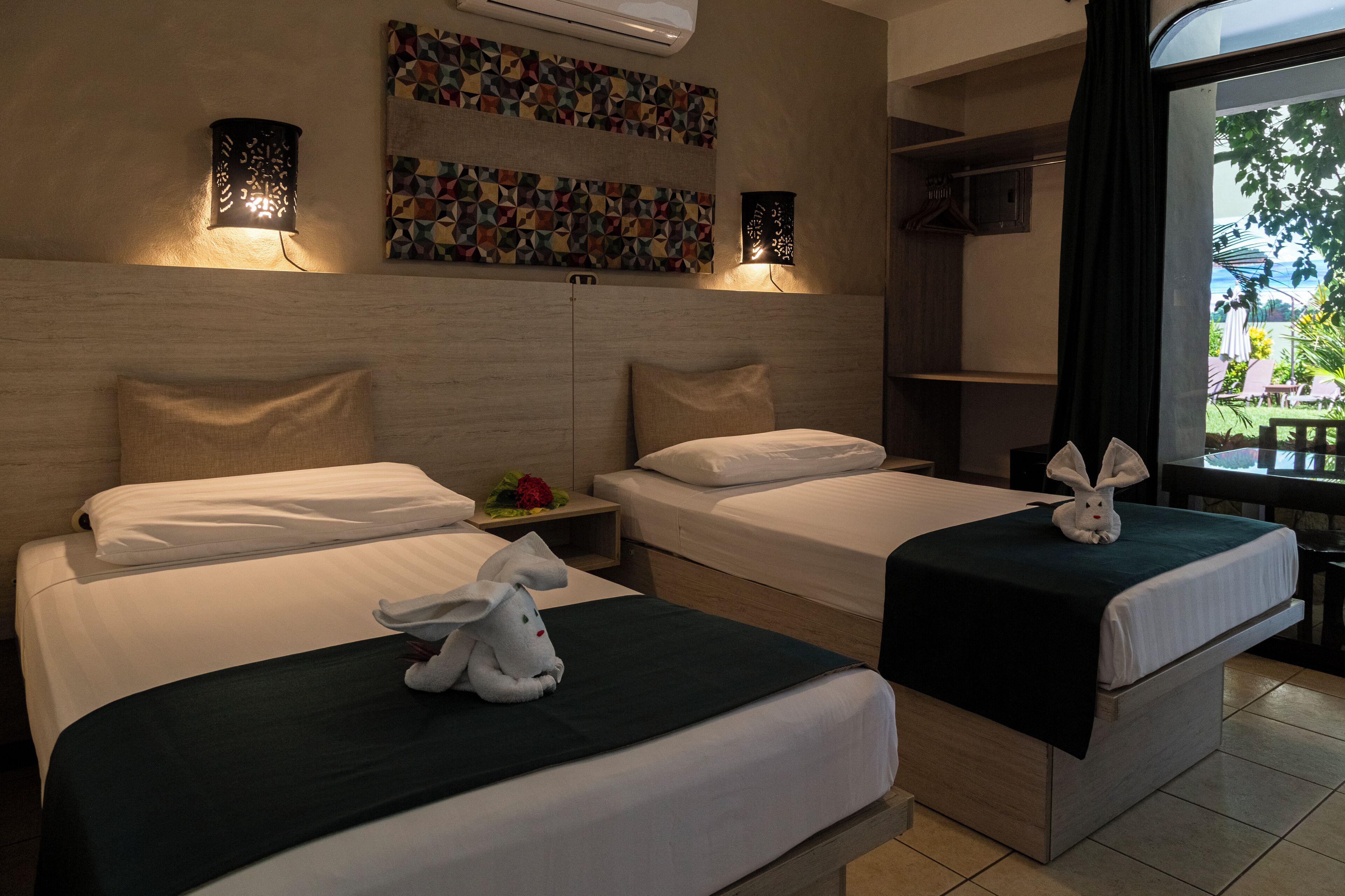 double room, pool view | 1 bedroom, down duvets, in-room safe, desk