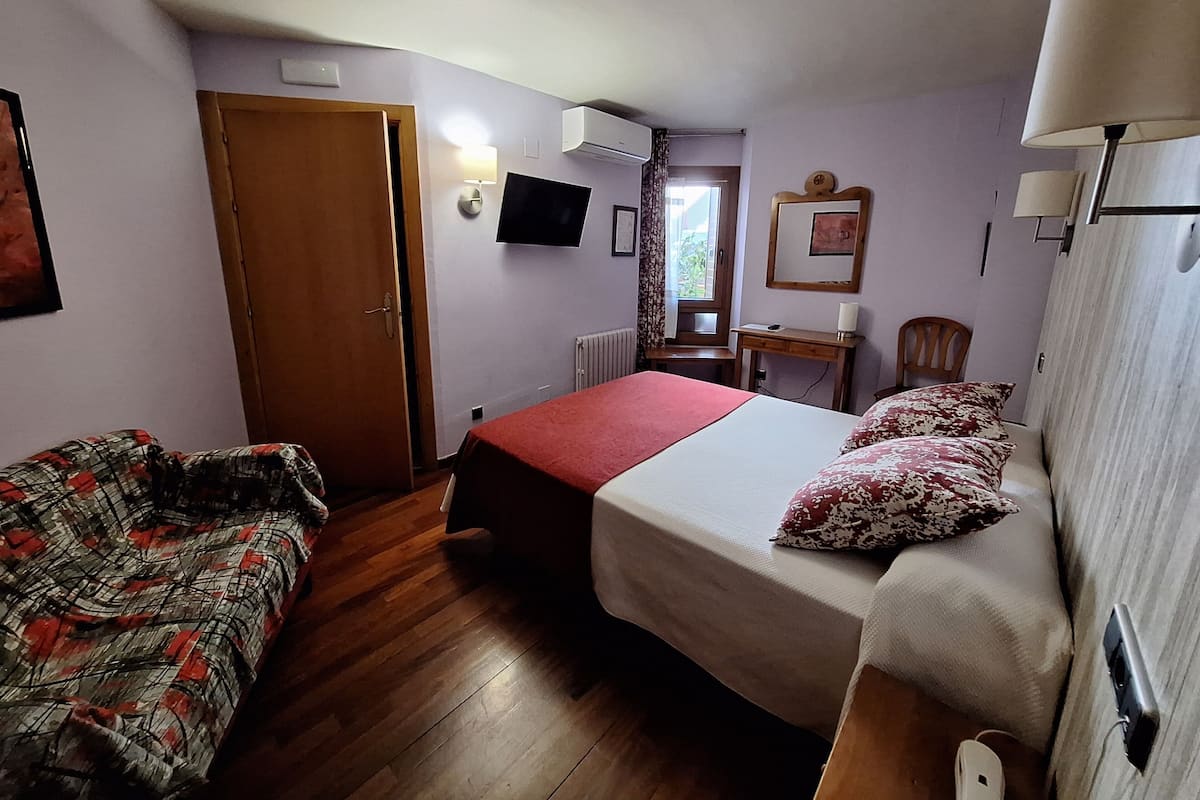 Double Room 1 bed Interior | Premium bedding, desk, laptop workspace, blackout drapes