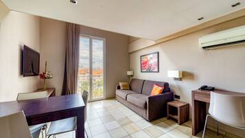 Superior Duplex | Living area | 120-cm flat-screen TV with satellite channels, TV