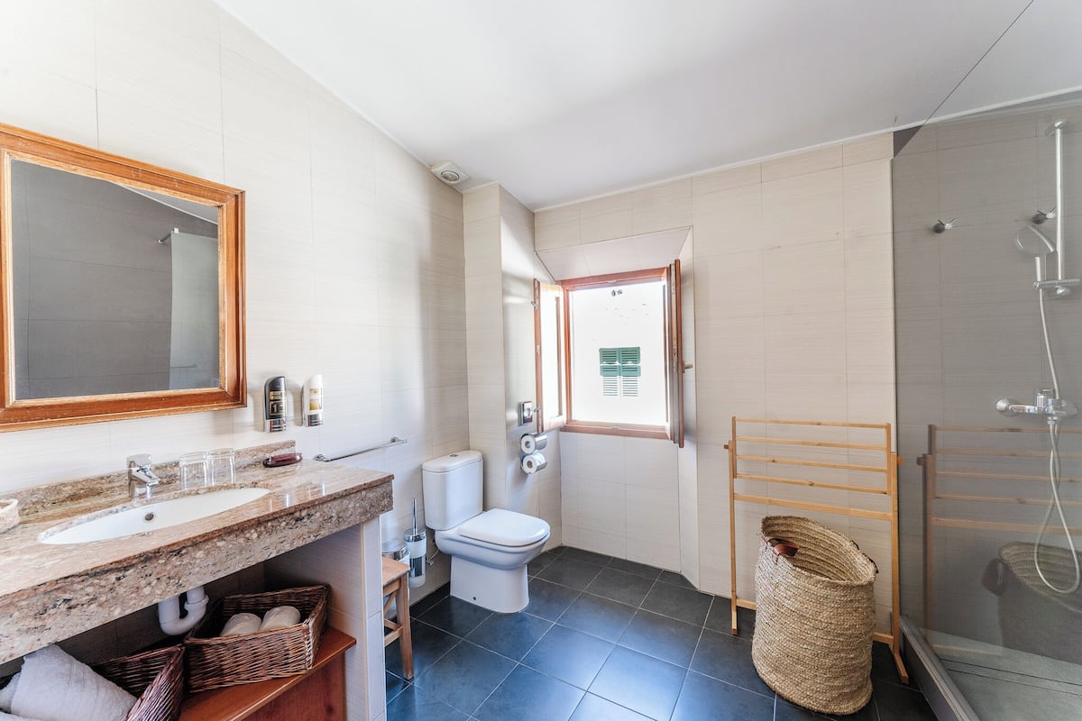 junior studio suite (3 people) | bathroom | deep-soaking bathtub, designer toiletries, hair dryer, bathrobes