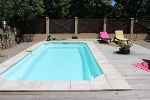 Seasonal outdoor pool, pool umbrellas, pool loungers