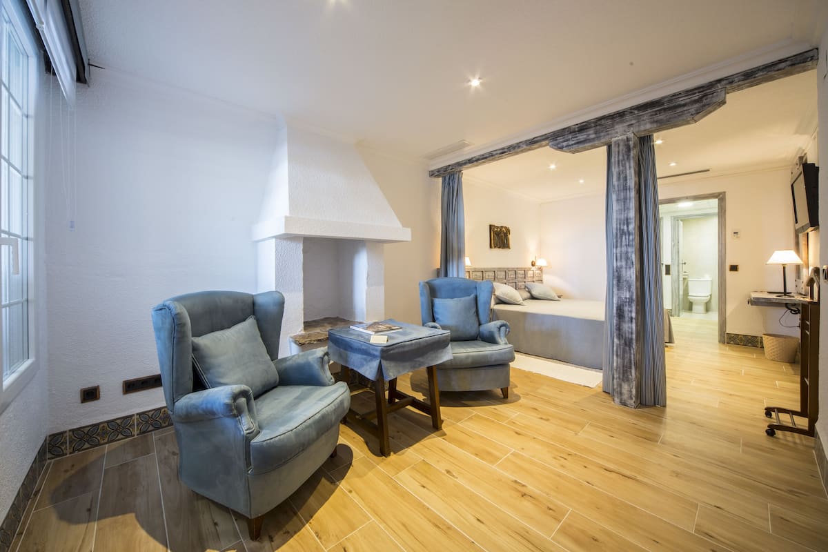 Double Room, Pool View, Ground Floor | Minibar, in-room safe, individually decorated, desk