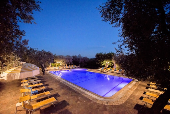 Outdoor pool, open 9:00 AM to 7:00 PM, pool umbrellas, pool loungers