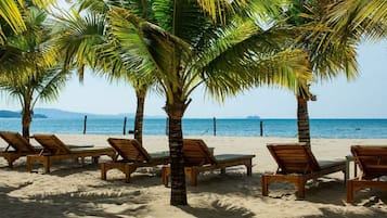 Private beach, white sand, sun loungers, beach umbrellas