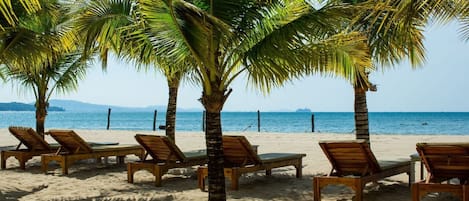 Private beach, white sand, sun loungers, beach umbrellas