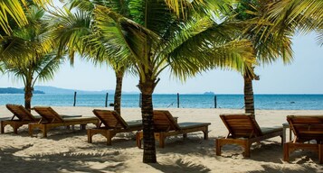 Private beach, white sand, sun-loungers, beach umbrellas