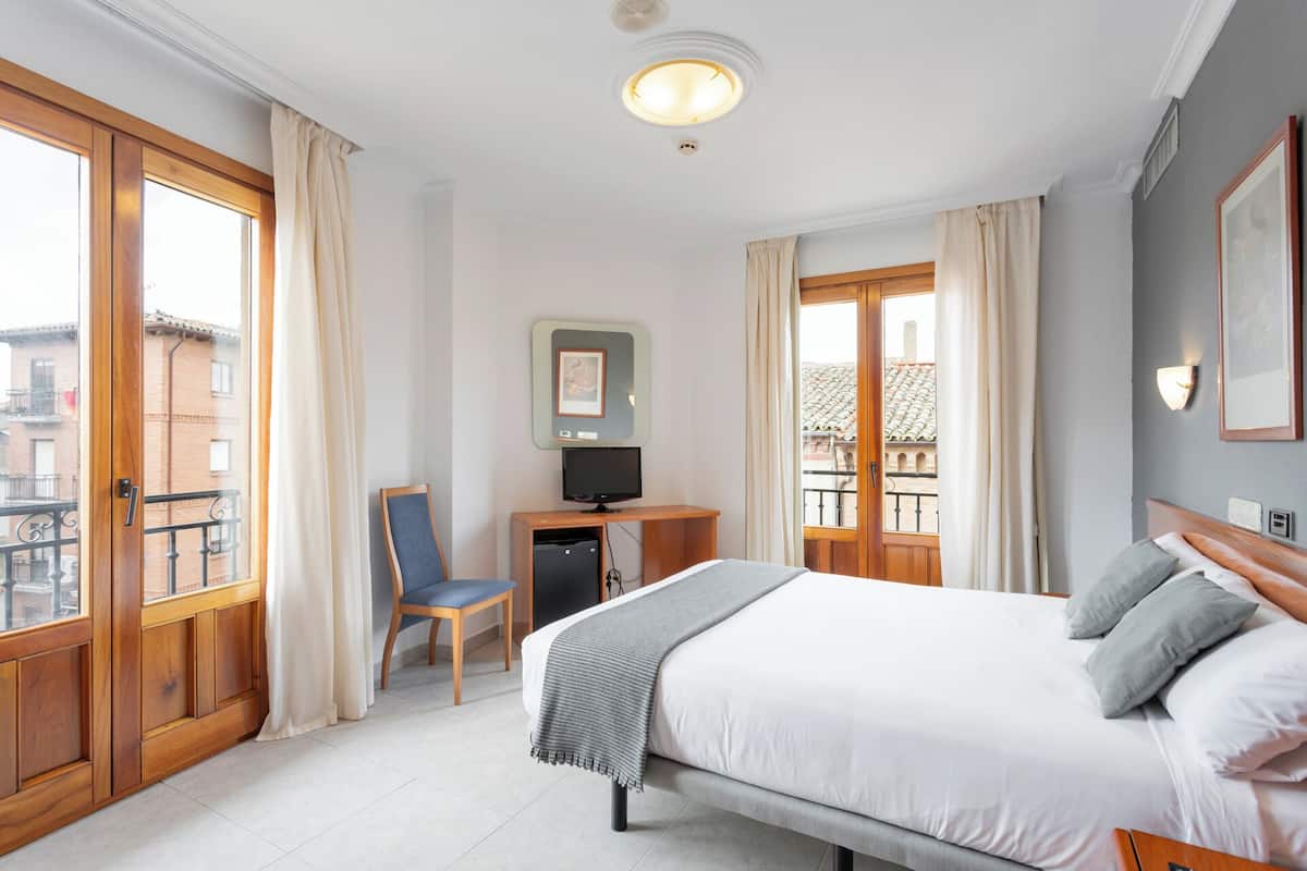 Desk, blackout curtains, free WiFi, bed sheets