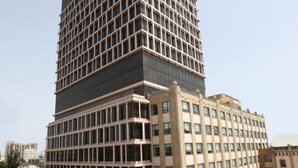 A multi-story building with a grid-like facade, a flat roof, and a parking lot in front. - The Landmark Hotel (Baku)