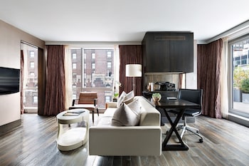 Penthouse, 1 King Bed | Living room | 37-inch flat-screen TV with cable channels, TV, iPod dock at Hotel 48LEX New York