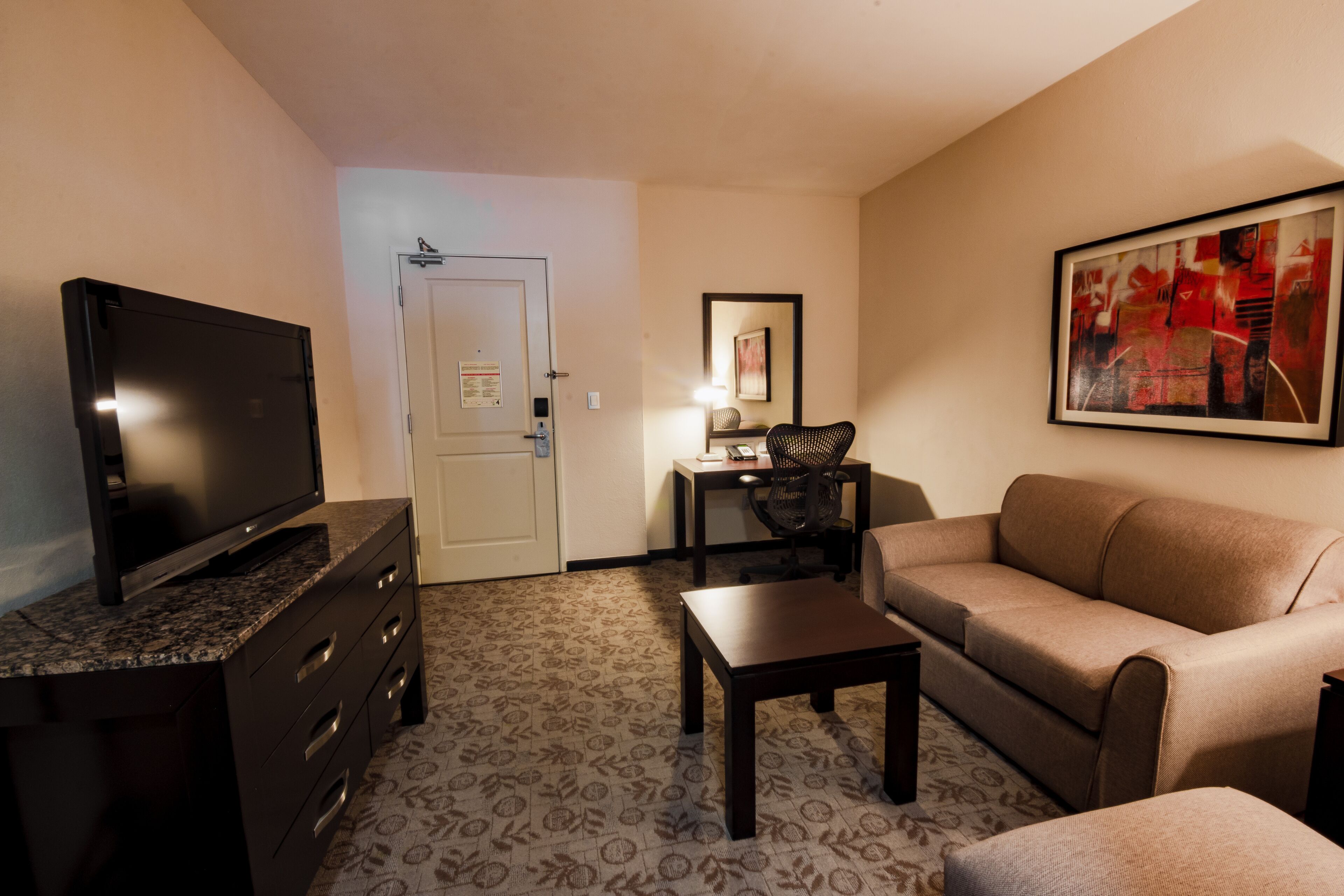 king bedroom evolution suite | living area | lcd tv, pay films, heated floors