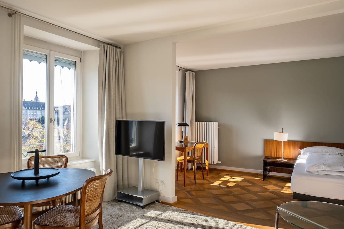 Junior Suite, River View | Living area | Flat-screen TV