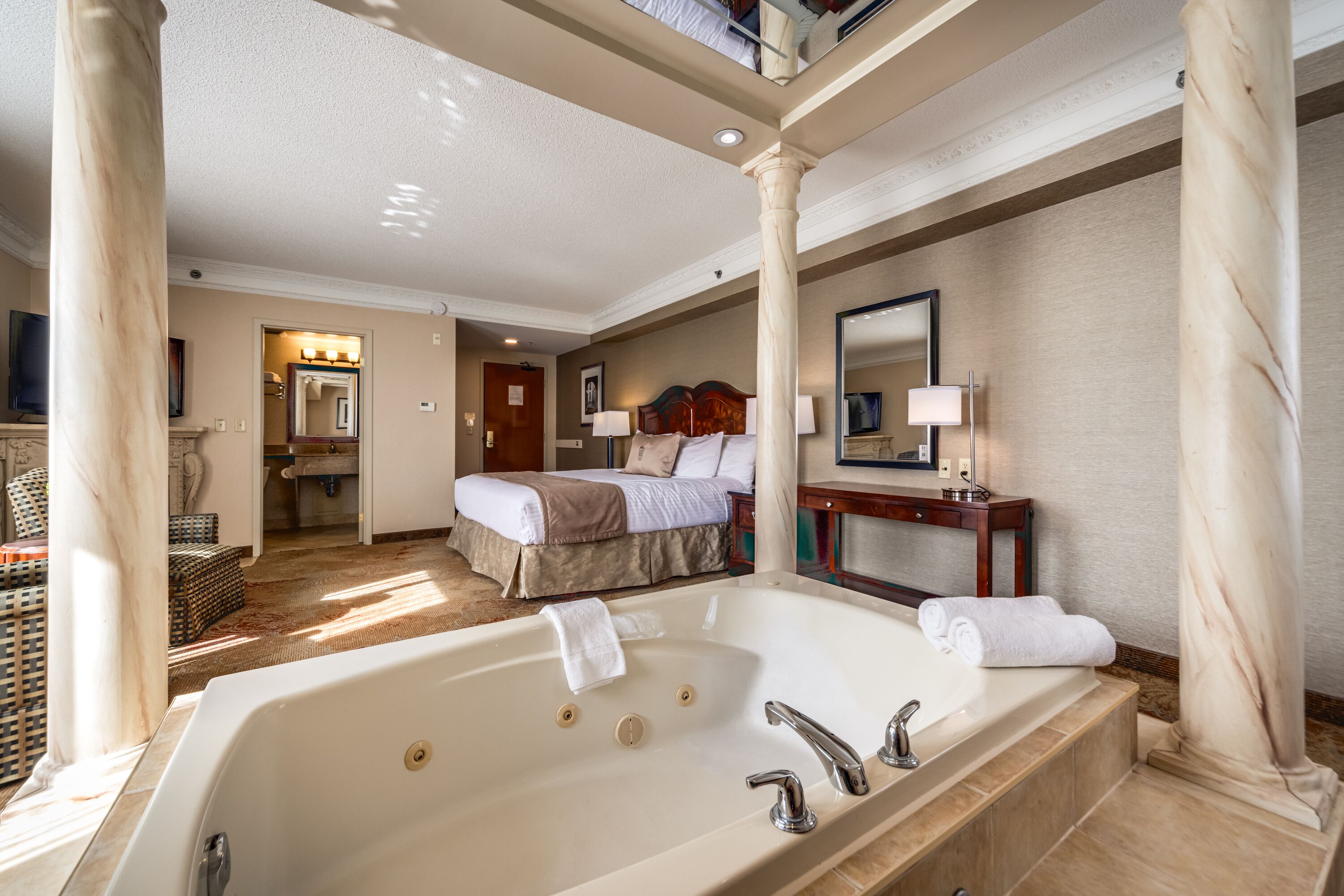 luxury king suite with jetted tub | premium bedding, down duvets, in-room safe, individually decorated