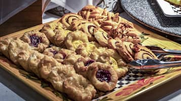 A tray of pastries on a decorative plate.