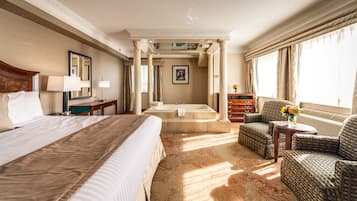 Luxury King Suite with Jetted Tub | Premium bedding, down comforters, in-room safe, individually decorated