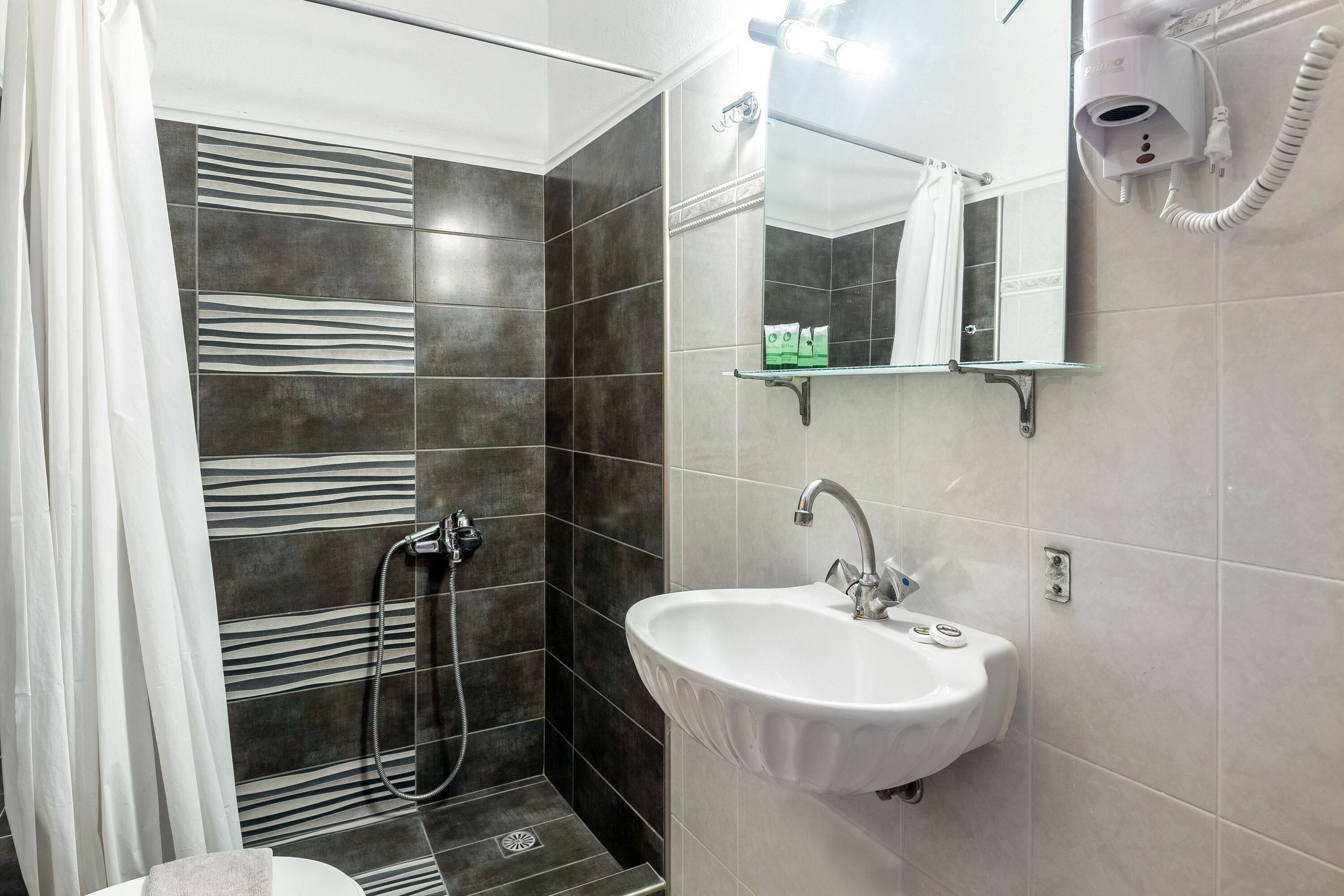 double or twin with meteora view | bathroom | deep-soaking bathtub, towels