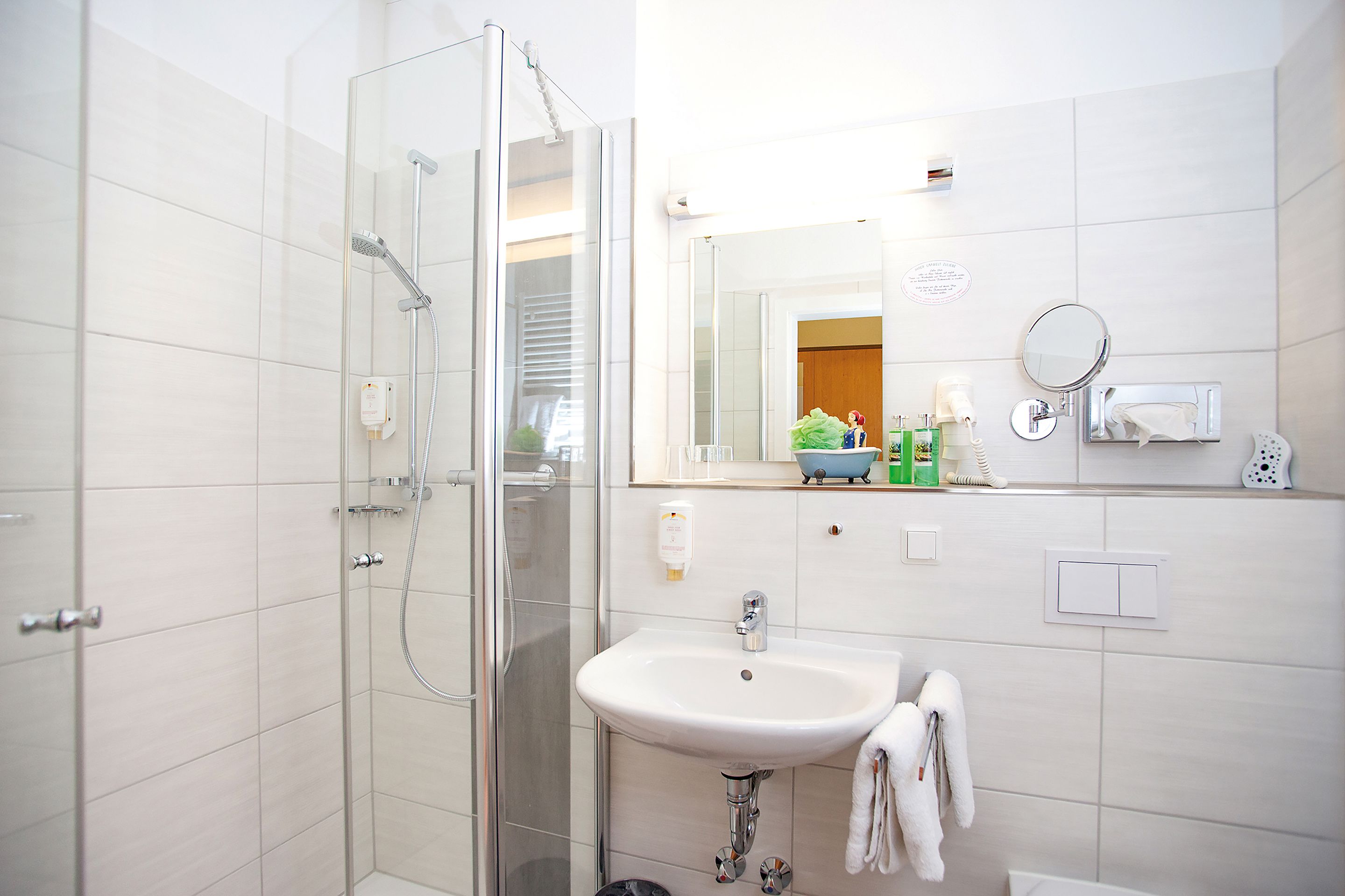 shower, free toiletries, hair dryer, towels