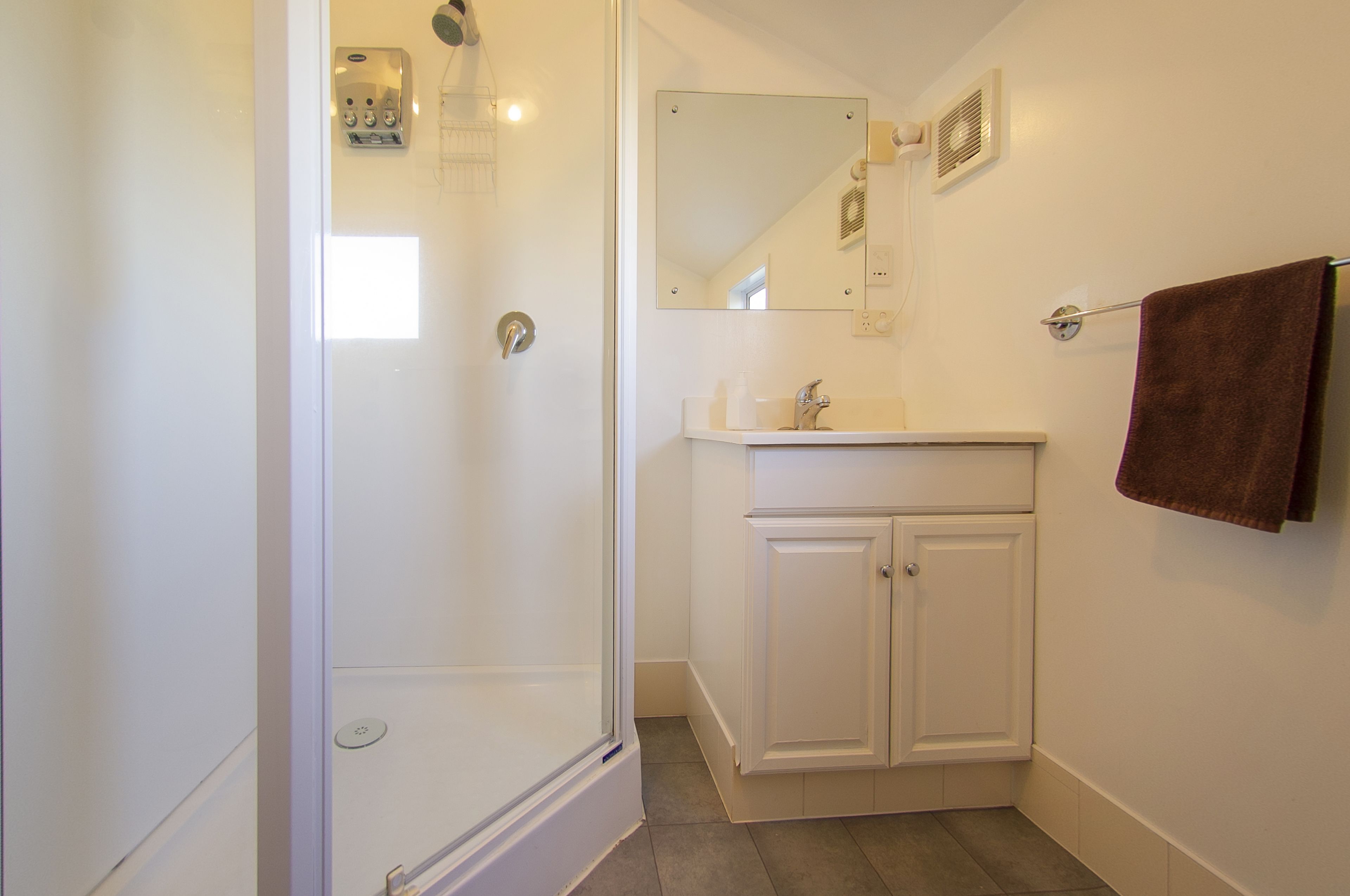 queen room with free netflix | bathroom | shower, hair dryer, towels