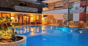 Outdoor pool, open 8:00 AM to midnight, pool umbrellas, sun loungers