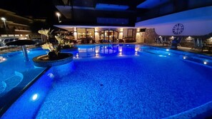 Outdoor pool, open 8:00 AM to midnight, pool umbrellas, sun loungers