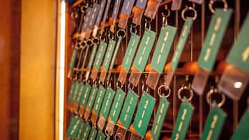 A wall of numbered keychains hanging in a row.