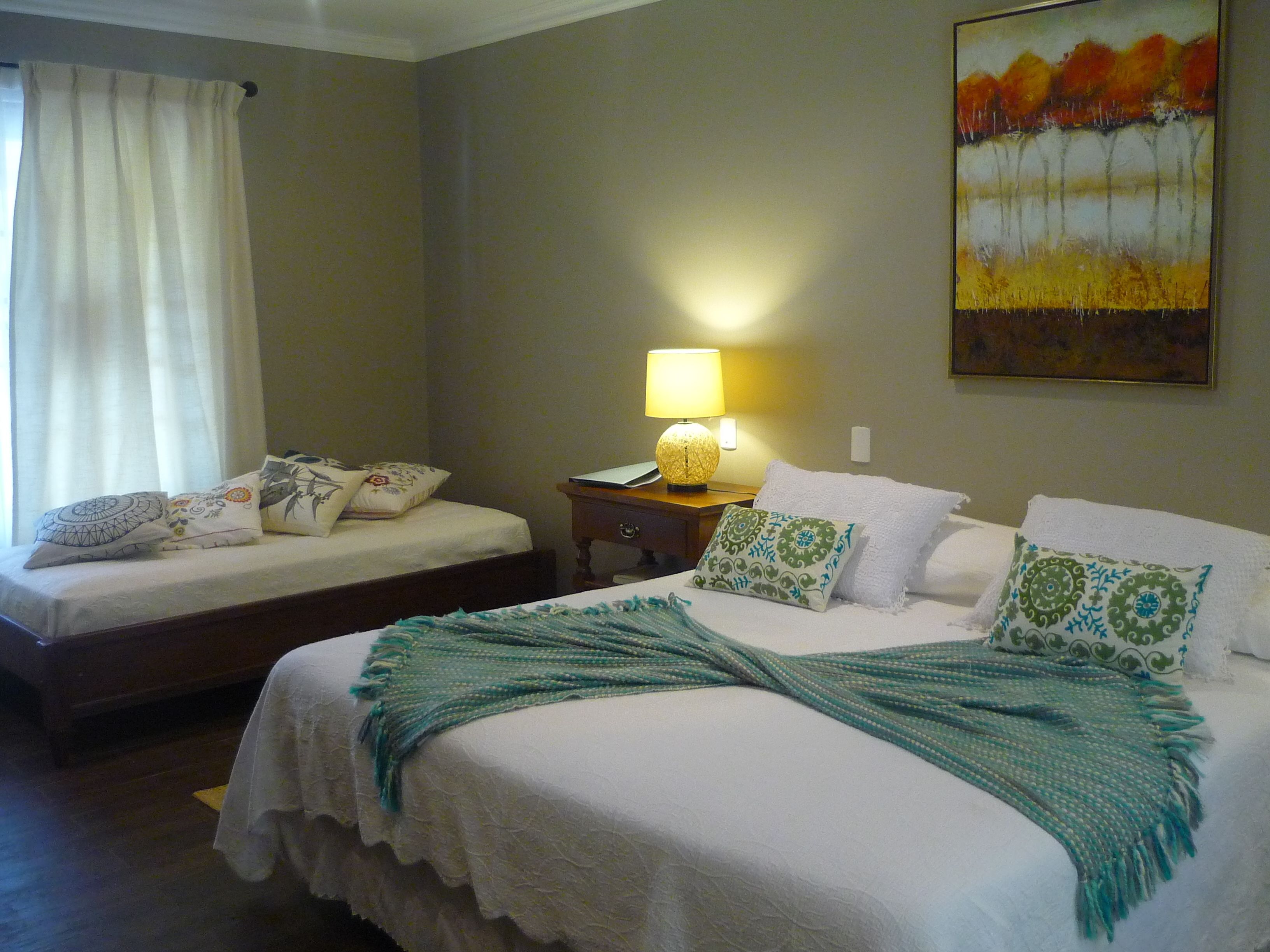 deluxe suite, 1 king bed, pool view | pillow-top beds, minibar, in-room safe, individually decorated