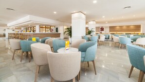 A spacious lobby with a bar area, seating arrangements, and a reception desk. - Globales Santa Lucia Hotel Adults Only +18 (Calvia)