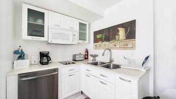 Apartamento família, 2 quartos, cozinha | Cozinha privada | Frigobar, máquina de café expresso