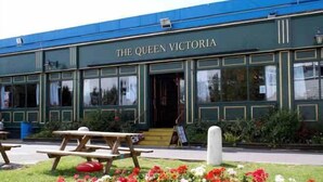 A building with the sign "THE QUEEN VICTORIA" indicating a pub or restaurant. - Southport Holiday Park (Southport)