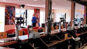 A salon with multiple mirrors, chairs, and hairdressing equipment. - Southport Holiday Park (Southport)