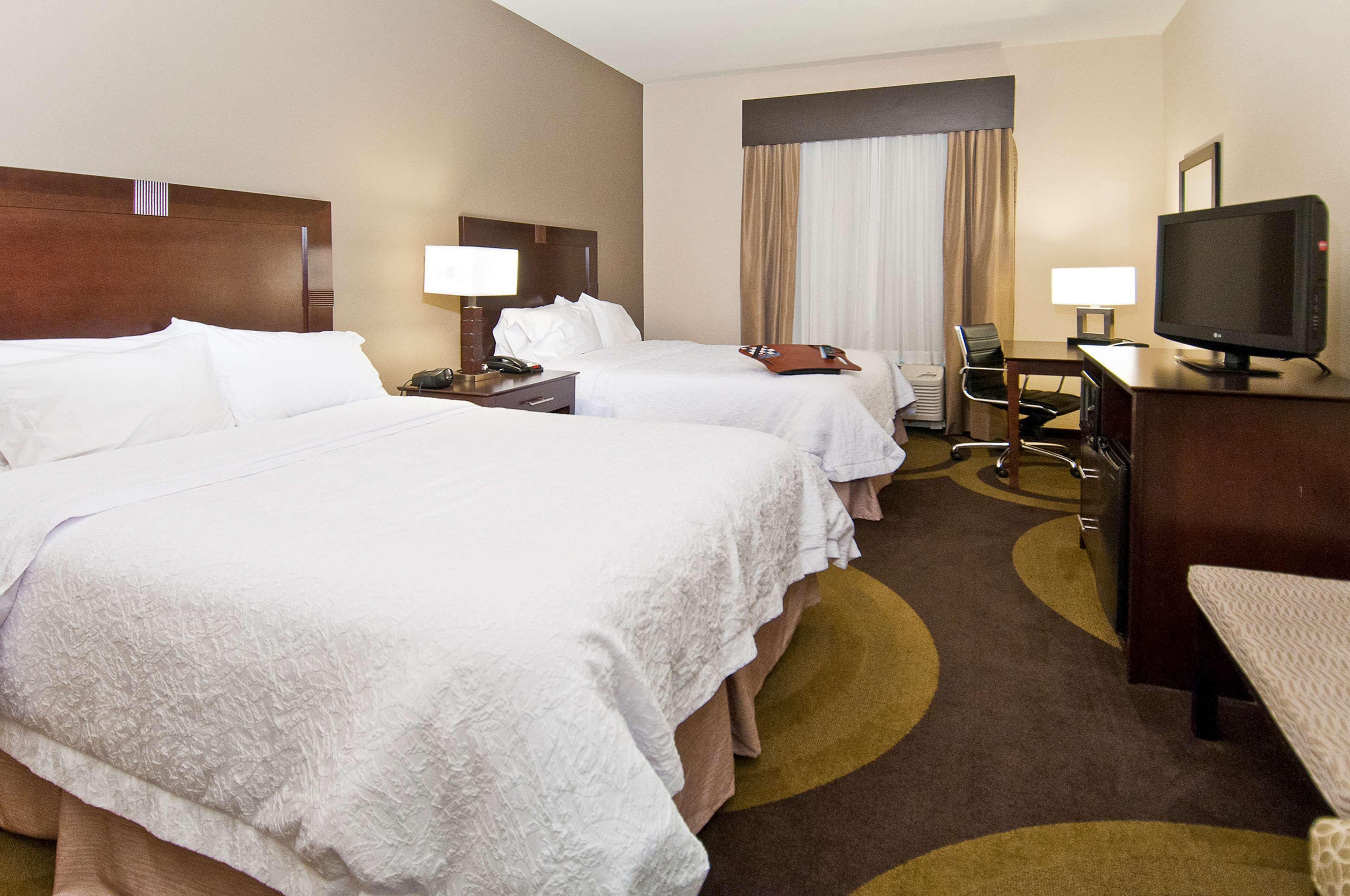 2 queen beds | in-room safe, desk, iron/ironing board, free wifi