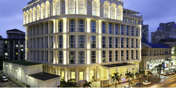 A multi-story hotel with a classic architectural style, featuring a curved facade and large windows. - Meluha The Fern Mumbai, Powai, Series by Marriott (Mumbai)