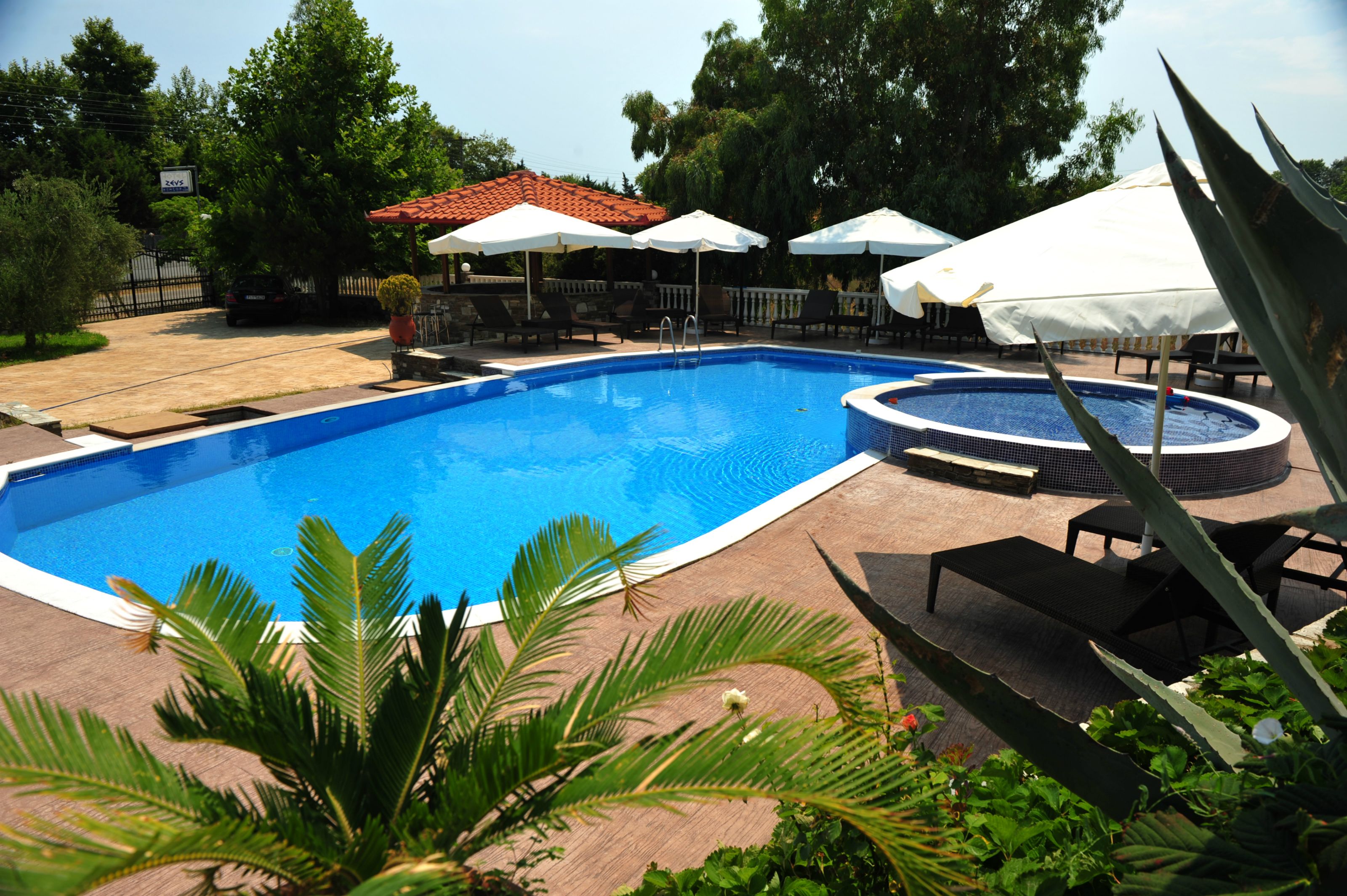 2 outdoor pools, pool umbrellas, pool loungers