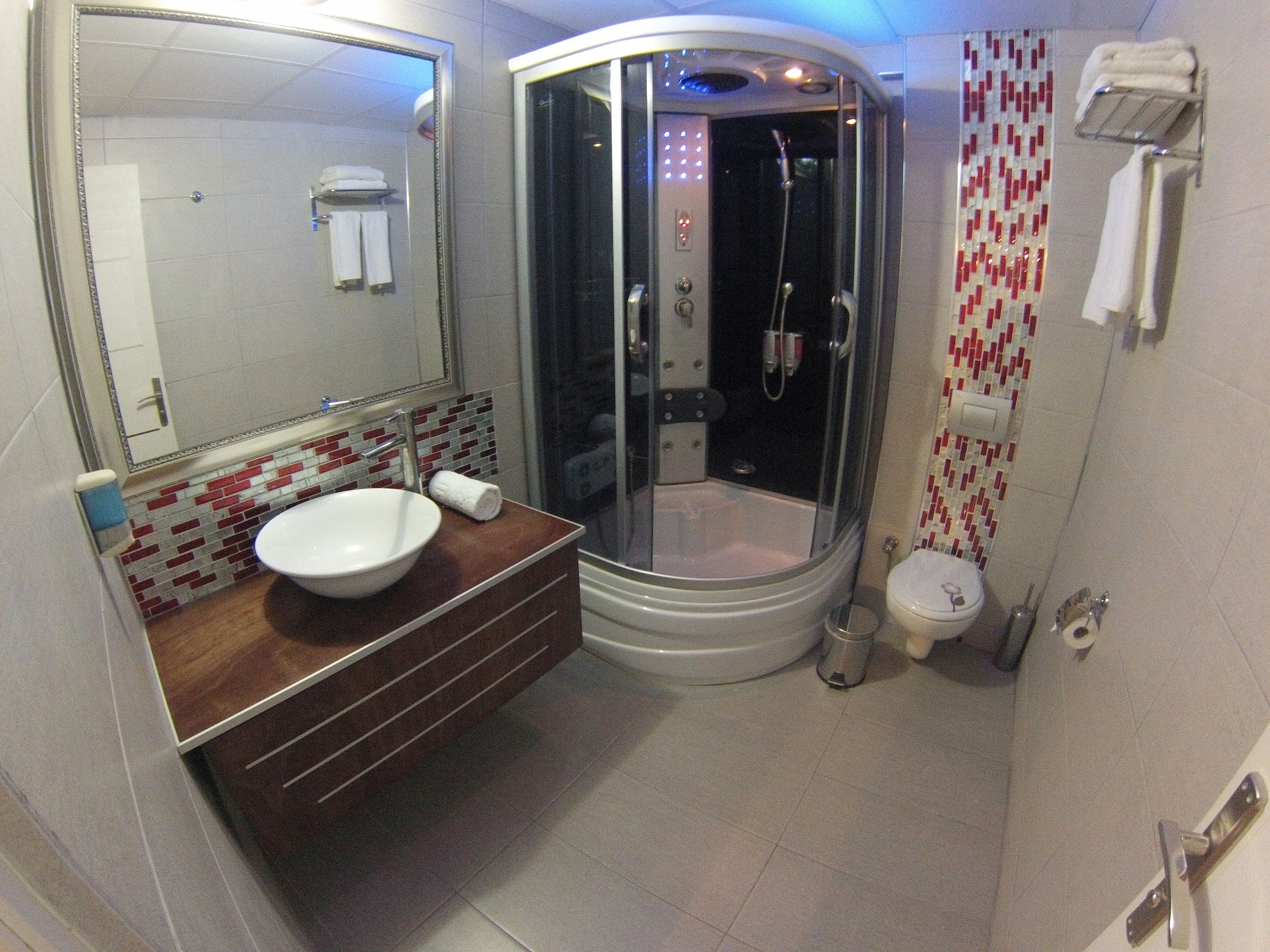 deluxe double or twin room | bathroom | hair dryer, slippers, towels