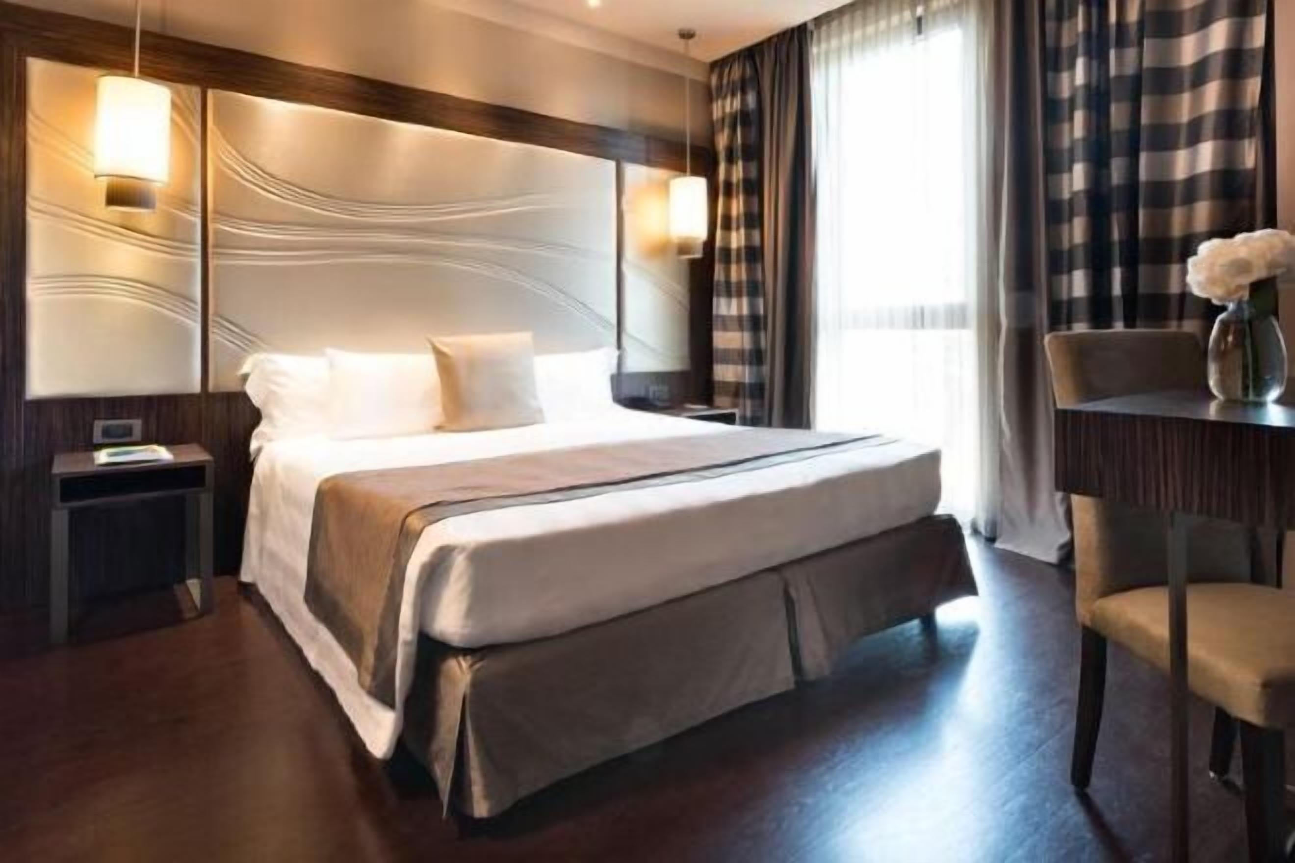 Premium bedding, down comforters, minibar, in-room safe