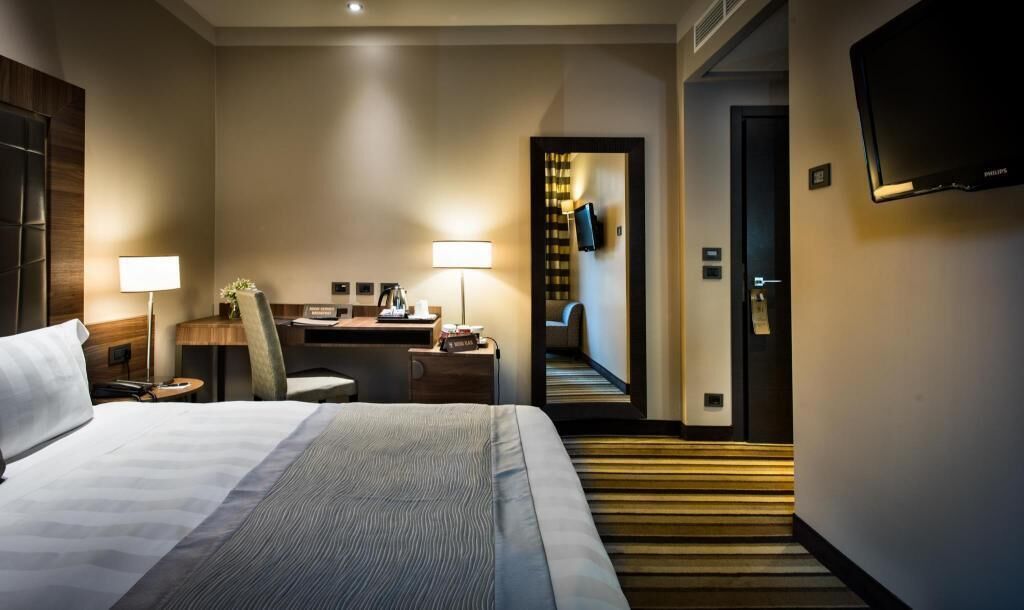 Premium bedding, down comforters, minibar, in-room safe