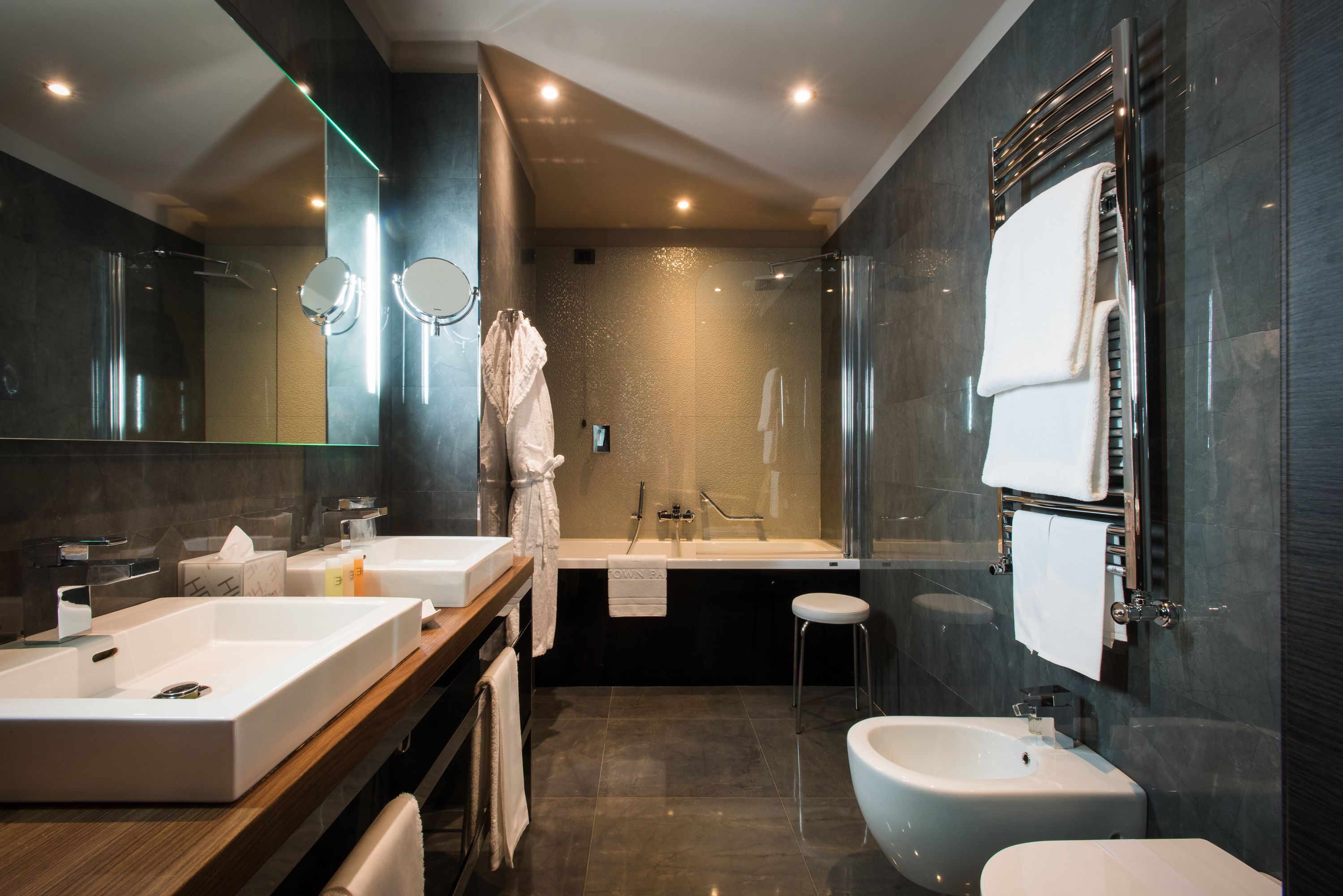 junior suite | bathroom | shower, free toiletries, hair dryer, bathrobes