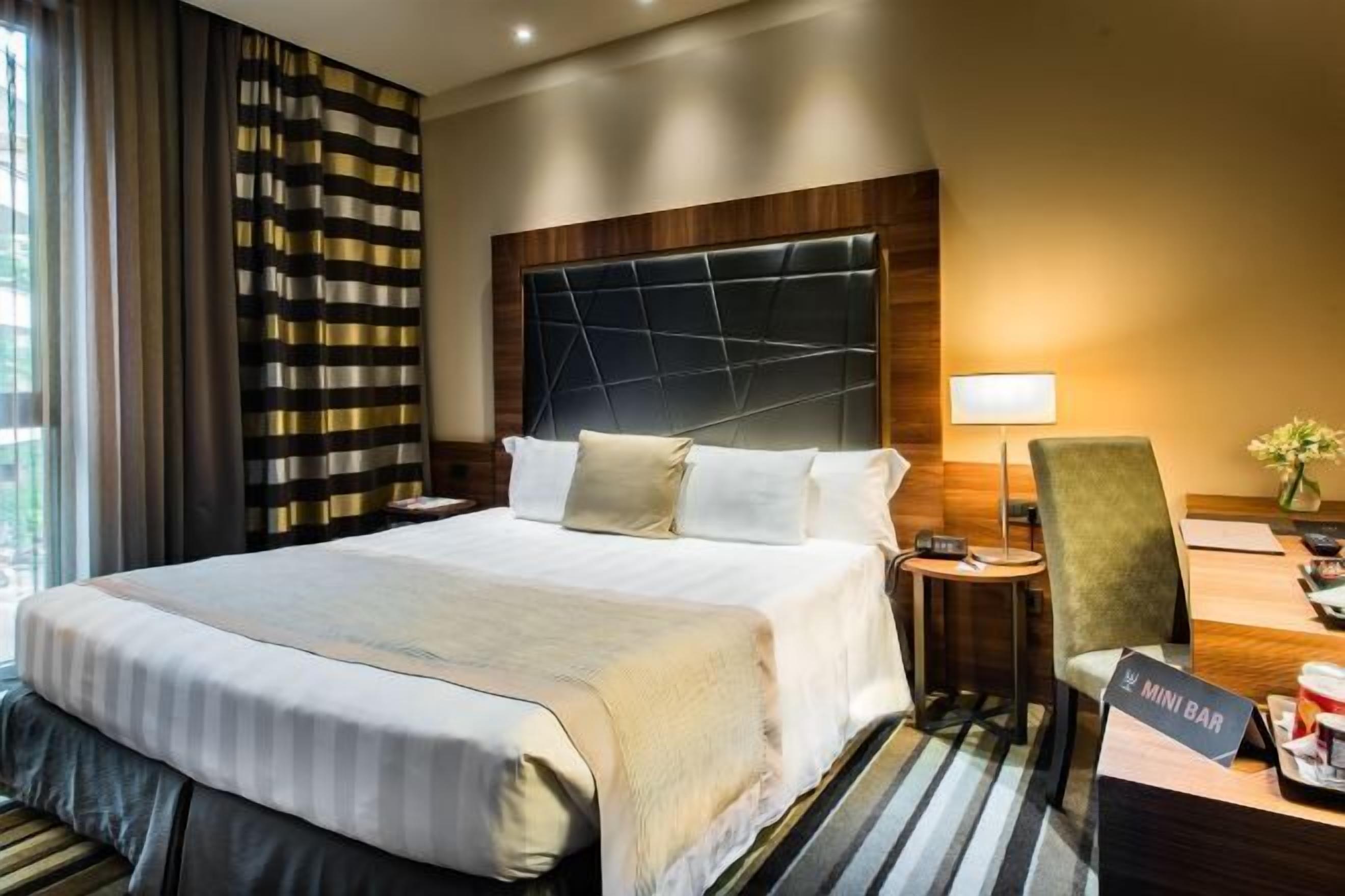 Premium bedding, down comforters, minibar, in-room safe